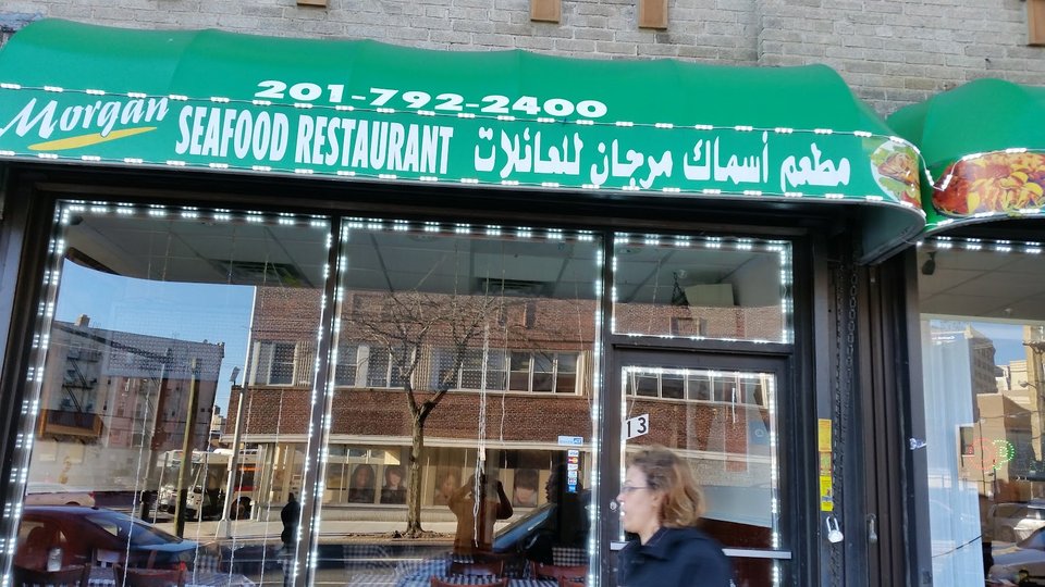 Restaurant entrance with accessible seating inside.
